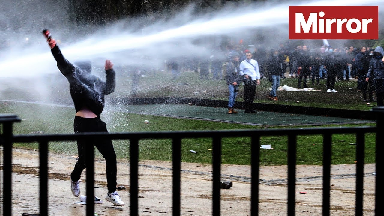 Riot police clash with Covid protestors in Brussels