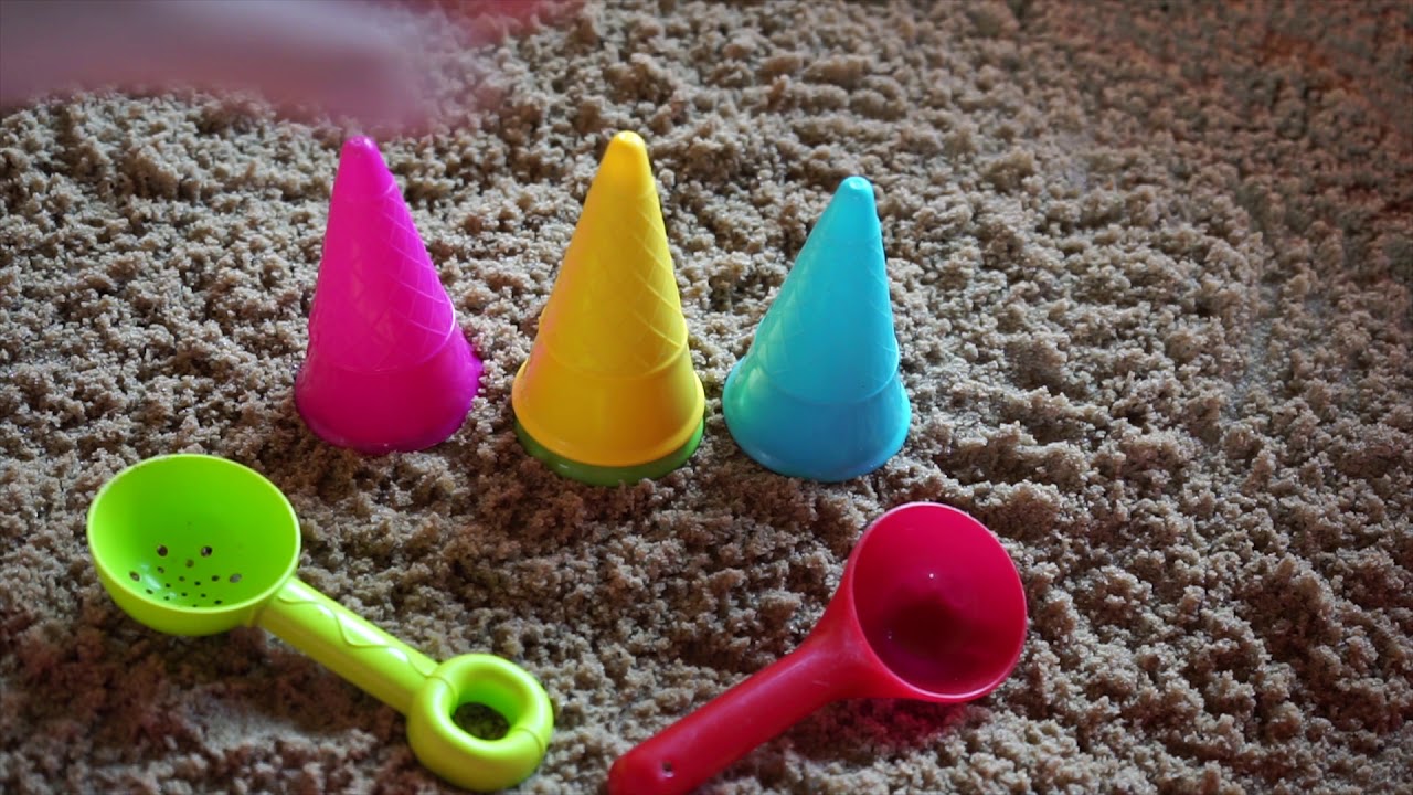 Colored cups for shortbread ice cream. Games for children with sand ...