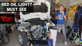 WHY I HAVE RED OIL LIGHT ON MY  CAR