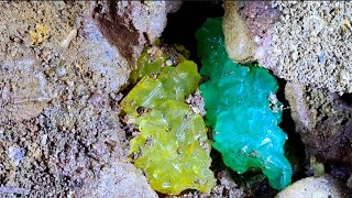 Colorful crystals in a volcanic cave. Perfect digging process for diamonds, agates, emeralds