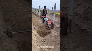 Tilling The Soil Preparing The Land For Planting