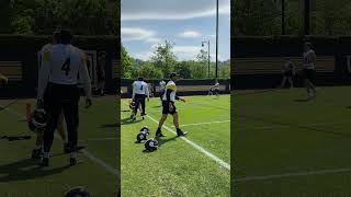 Aaron Rodgers heads to the field for the Steelers first OTA