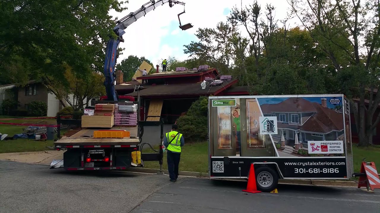 Crystal Exteriors LLC Boom Truck making shingle delivery to roof top. YouTube