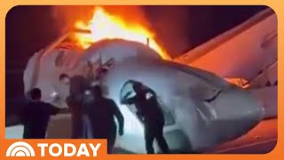 Video: Bystanders Race Toward Plane Wreckage to Free Survivors