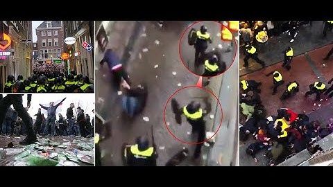 England fans clash with baton wielding cops in Amsterdam as over 100 arrests mar friendly match - 24