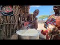 Traditionally organic african village family cooks the most organic chicken curry with corn flour