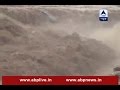 China Yellow River floods enlarge waterfall; visitors