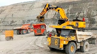 Large Excavator And Dump Truck Working In Coal Mine