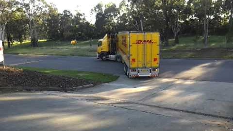 Backing up Scania R580 at work reversing semi trailer on blind side