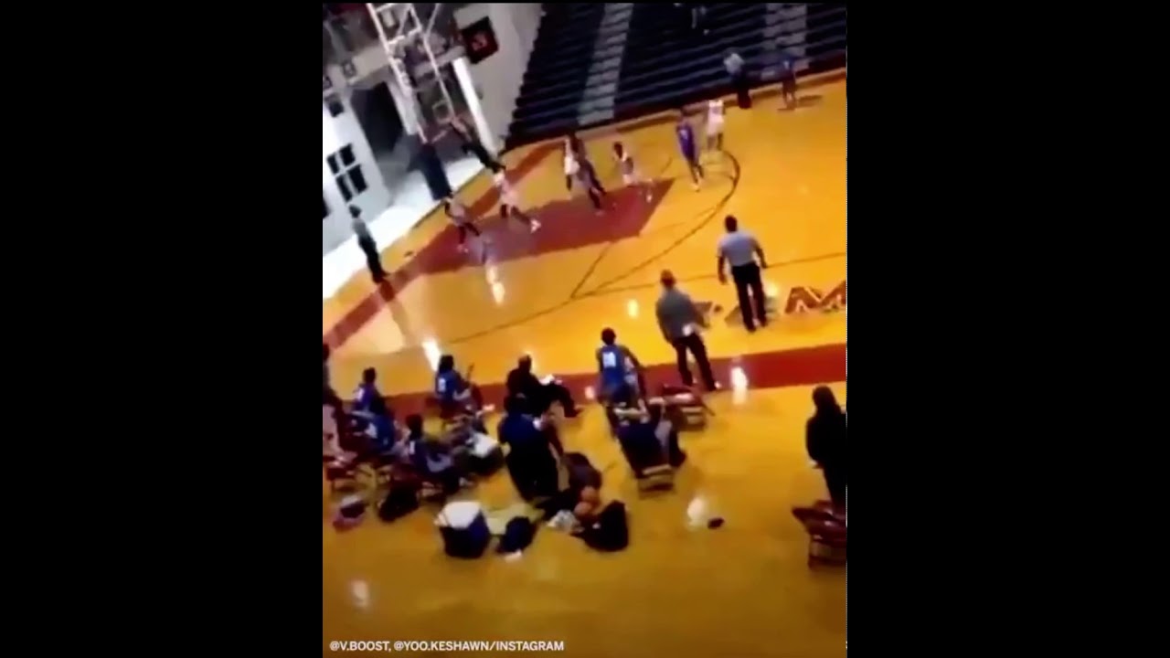Super Scary moment as an entire basket falls from the ceiling in a High School Basketball game
