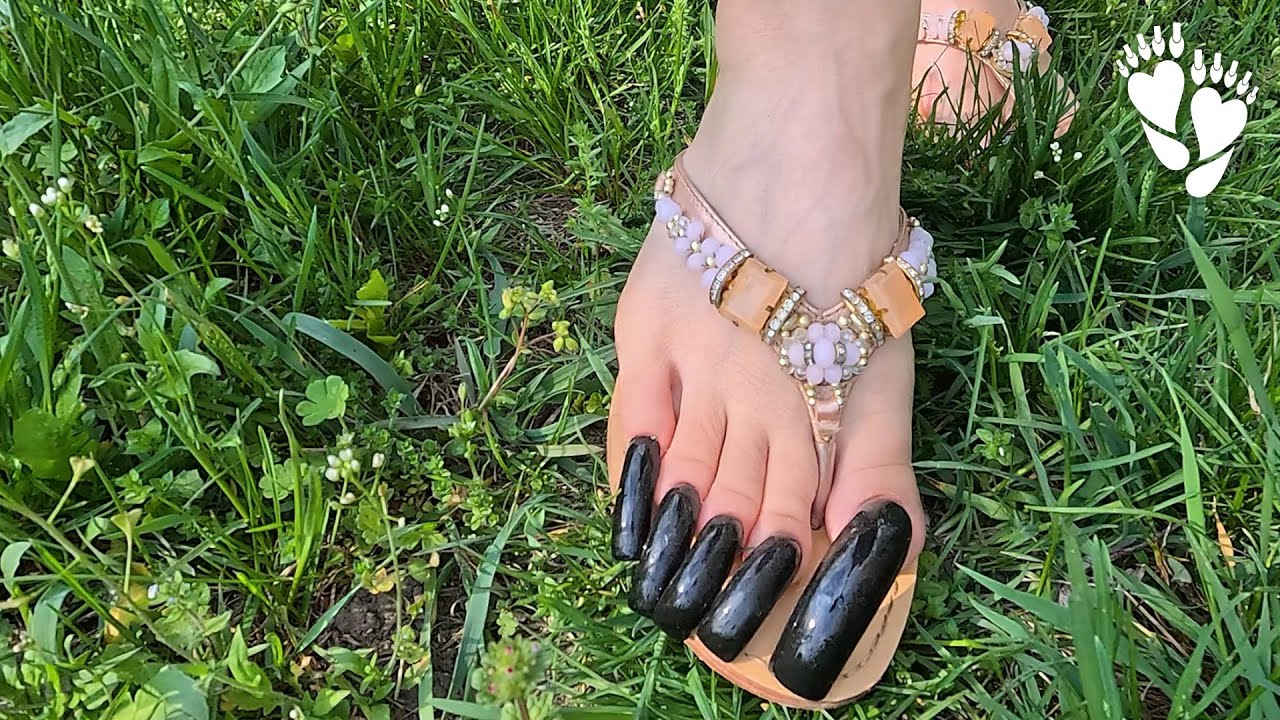 DEMO Walking on the grass with long black toenails