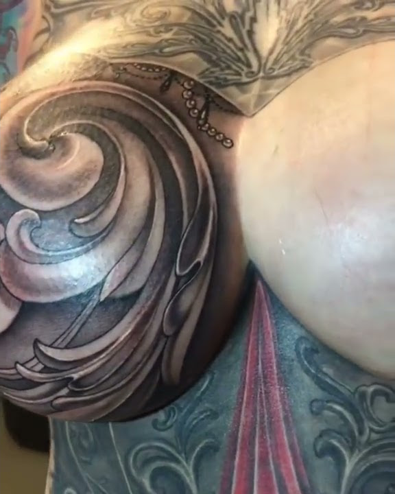 Breast tattoo by @nikkisimpsontattoos