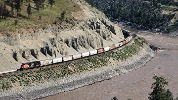 Giant CN Grain Train Snaking Around The Thompson Canyon Curves With A DPU