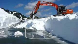 Excavator clears snow banks at Artist Point