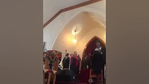 Pastor Creasey singing at CHURCH OF GOD PROPHECY