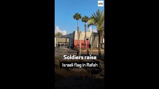 Soldiers raise Israeli flag in Rafah