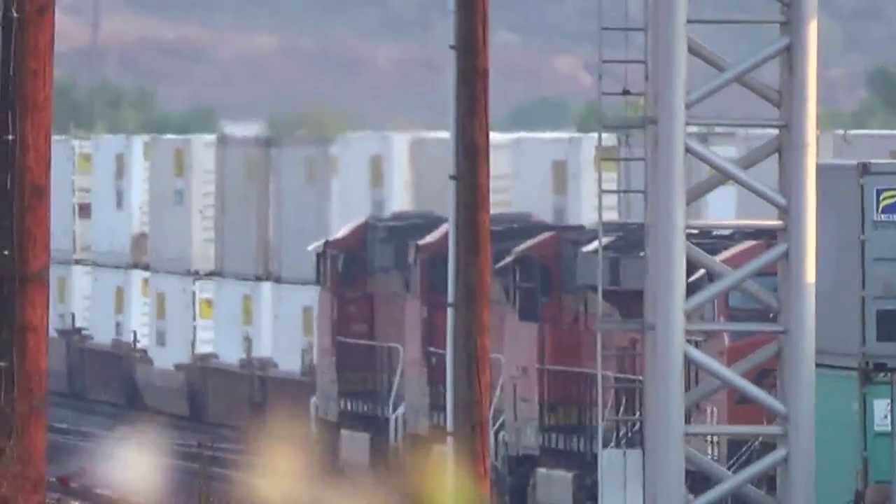 UP/BNSF train 7153/5494/5494 is going East bound and West bound through Cajon Pass CA