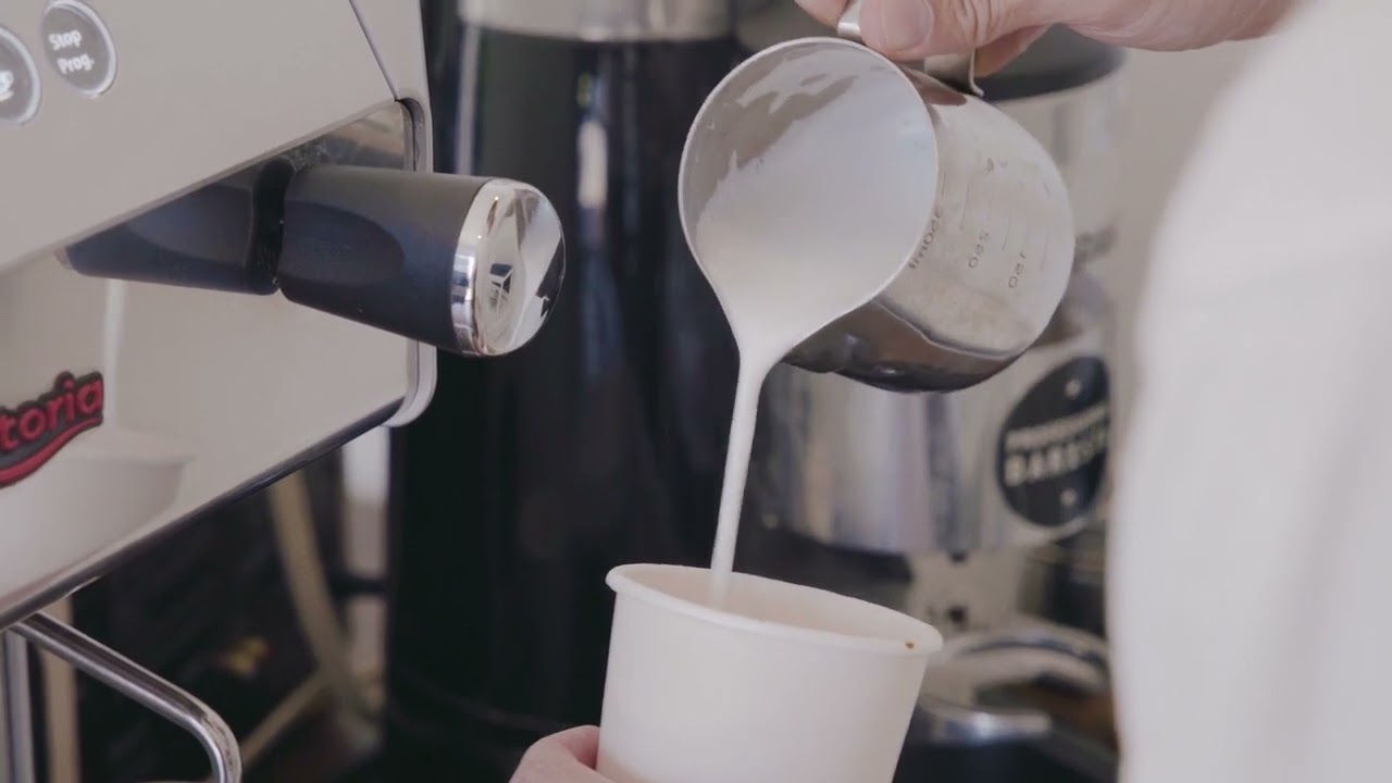 A Person Pouring Milk Froth into the Cup - YouTube