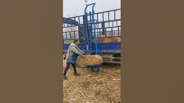 # straw bale elevator # straw bale artifact # straw bale loading and unloading machinery
