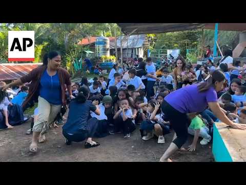School children scream and cry as 7.8 earthquake shakes the Philippines