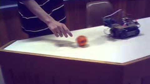 Color-based object tracking system using a track-vehicle robot. Method1