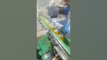 flying fiber laser marking machine engrave date on mango juice cans in the beverage assembly line