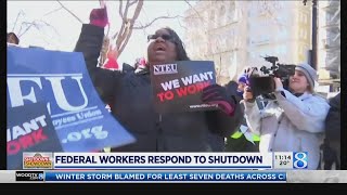 Federal workers protest, sue as shutdown enters third week