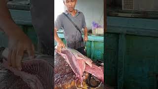 Witnessing Bang Rahman's skill in filleting tuna to perfection