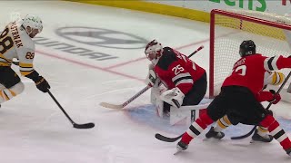 David Pastrnak scores a goal against the New Jersey Devils