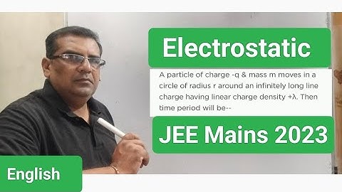 A particle of charge -q and mass m moves in a circle of radius r around an infinitely long line