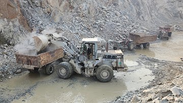 Caterpillar 966D Wheel Loader Loading Huge Rocks into Dump Truck & Tractor Trolleys