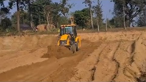 Jcb Backhoe pushing soil in leveling land @jcbmachinework @roadtrendmachinework