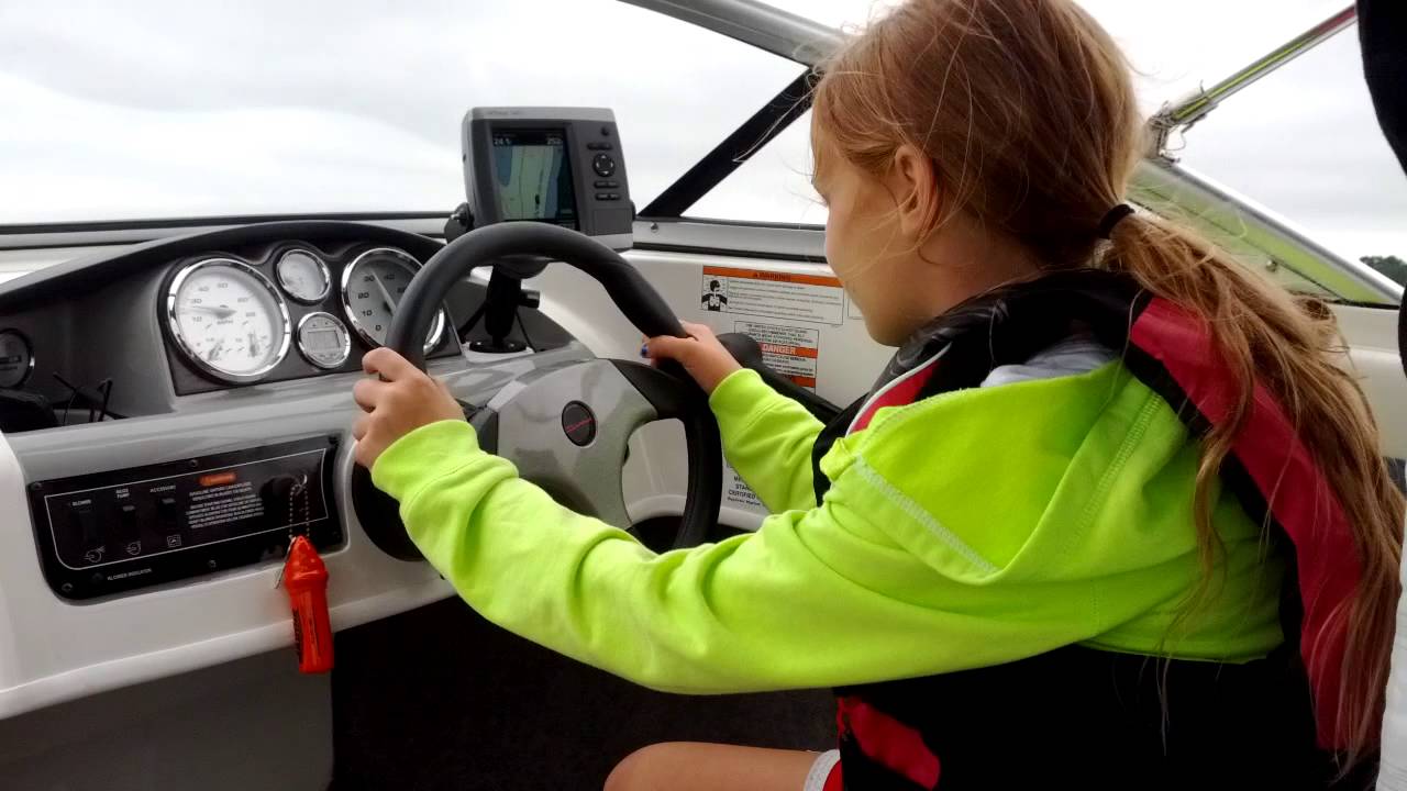 Kate driving the boat 2