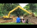 Long arm komatsu pc210 excavator clearing river sedimantation