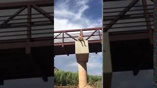 Kid does front flip from bridge
