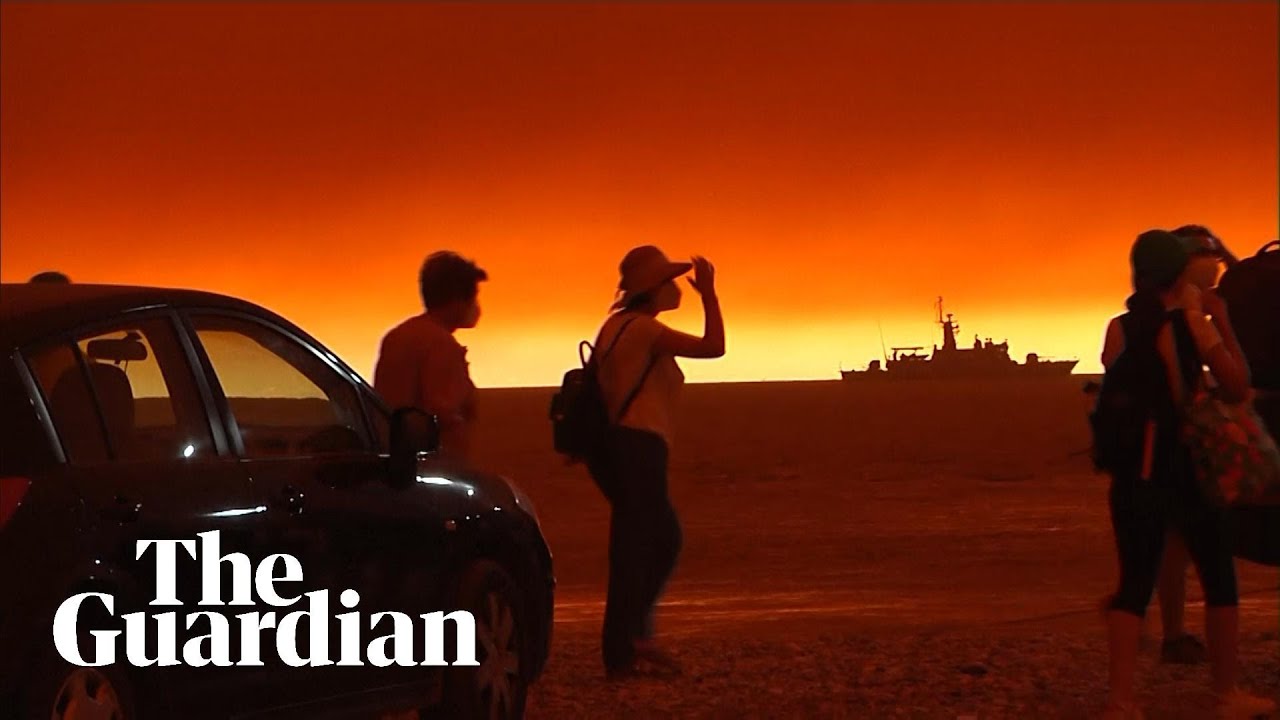 Sky glows red over ferry evacuating people from Greek island fire YouTube
