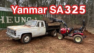 Yanmar SA325 with grapple, front end loader, and bucket clearing my property. Chevy R30 dump truck.