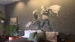 Street artist Banksy opens Walled Off Hotel in Bethlehem