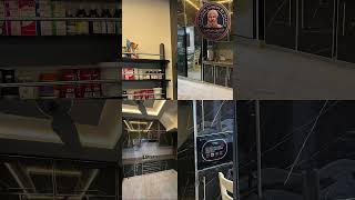 A sleek black marble-patterned finish paired with gold-toned trim for a luxury feel.