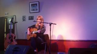 katie spencer performing her song magazines at john martyn gathering