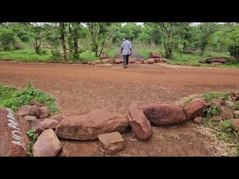 A quiet red-earth trail at Laharpur on a green monsoon morning
