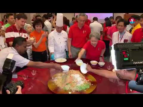CNY 2019: PM Lee and Mrs Lee take part in lohei session with workers newspaper mockup