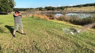 Shotgun 16 gauge slow motion water bottle explosion