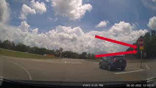 Rolling Through Stop Sign With Sign That Says "Cross Traffic Does Not Stop"