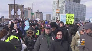 Thousands March Across Brooklyn Bridge In Anti-Hate Rally