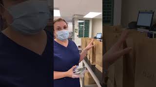Pharmacy Tech Lisa packs a medication order for Freeport Campus