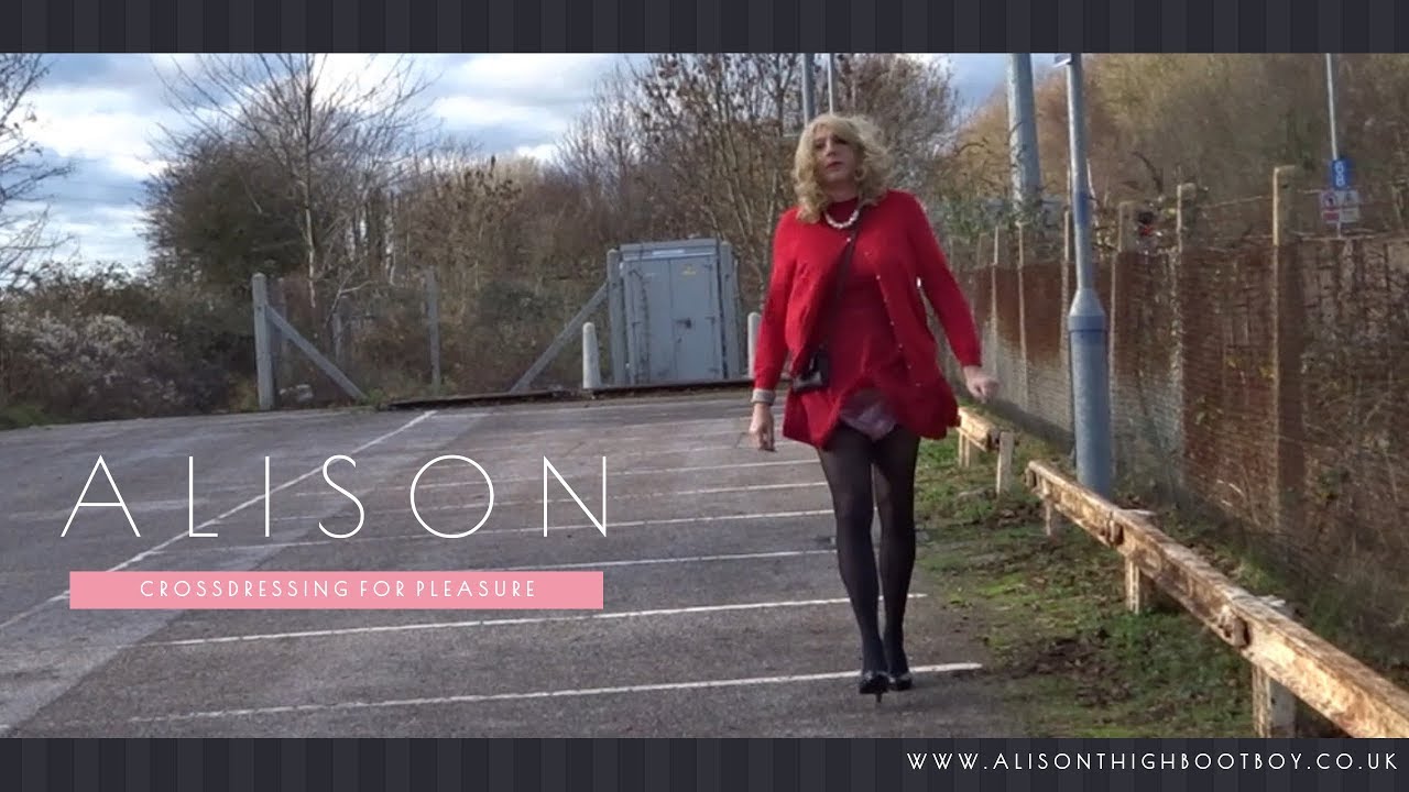 Wind catches dress revealing a glimpse - Crossdresser wearing plastic pants 