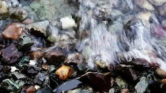 Water Washing Over Stone Coast Pebbles 4K Relaxing Screensaver