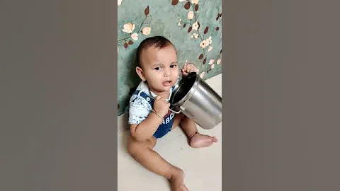 Cute baby head stuck in a pot
