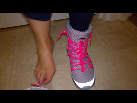 Her sockless Nike Rosherun boots shoeplay and sweaty feet